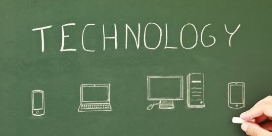 The words "technology" with and cell phone icon, computer icon, laptop icon, and tablet on a chalkboard.