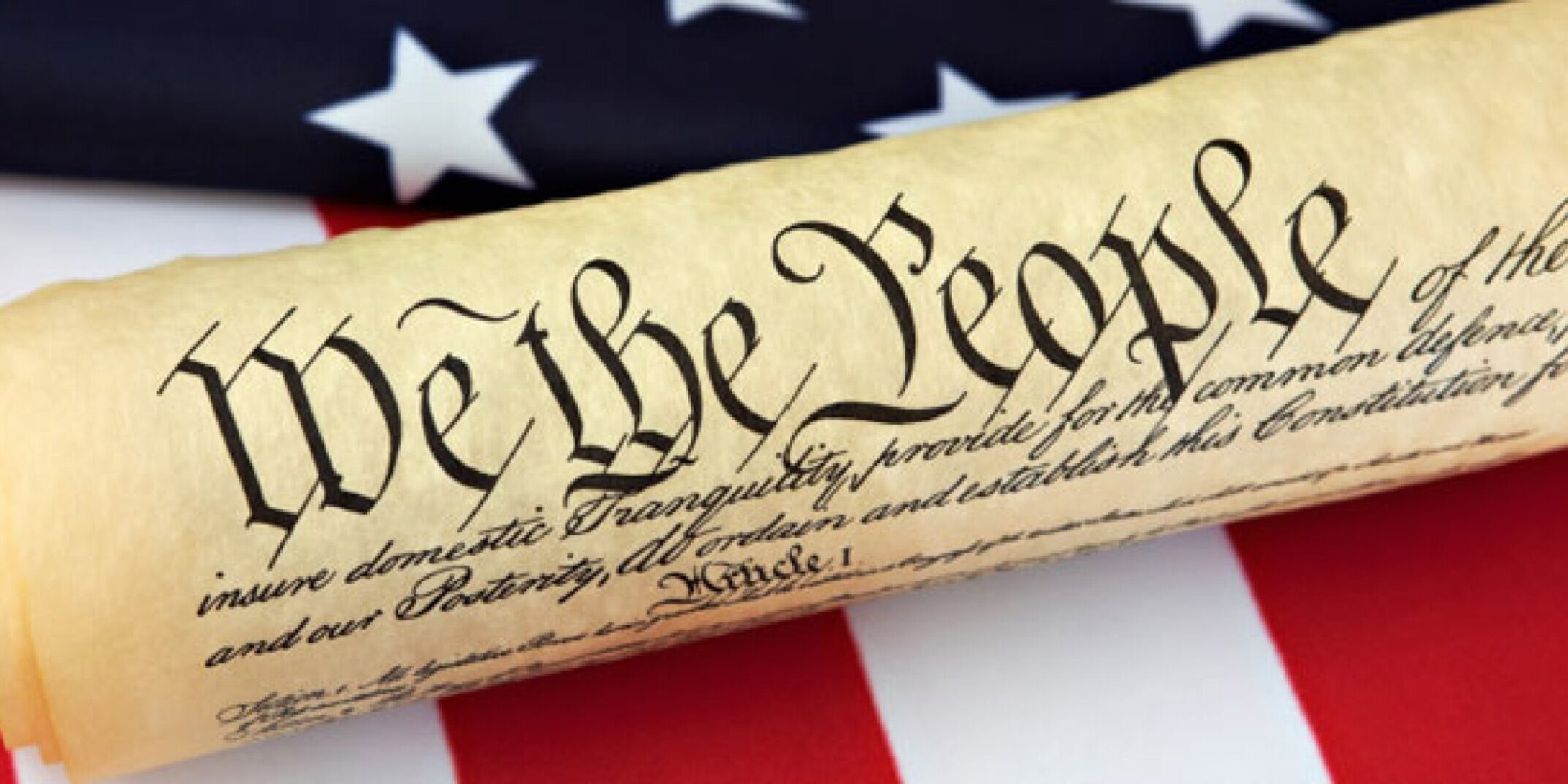 we-the-people We the people scroll on the American Flag.