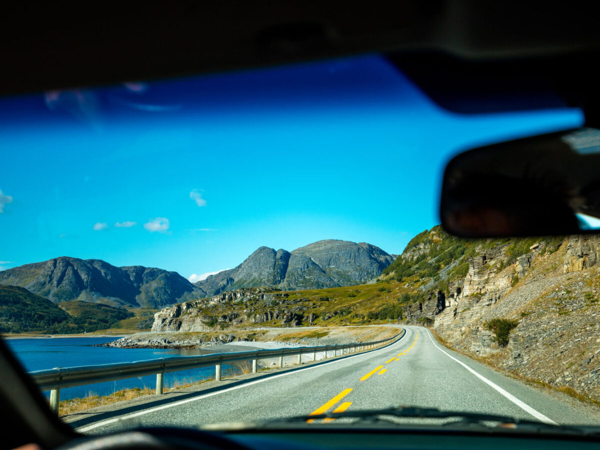 Driving down a road looking out from the driver's window