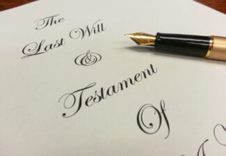 Paper with the last will and testament written on it.